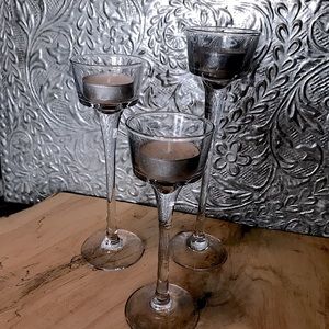 Set of three glass votive candle holders, different sizes